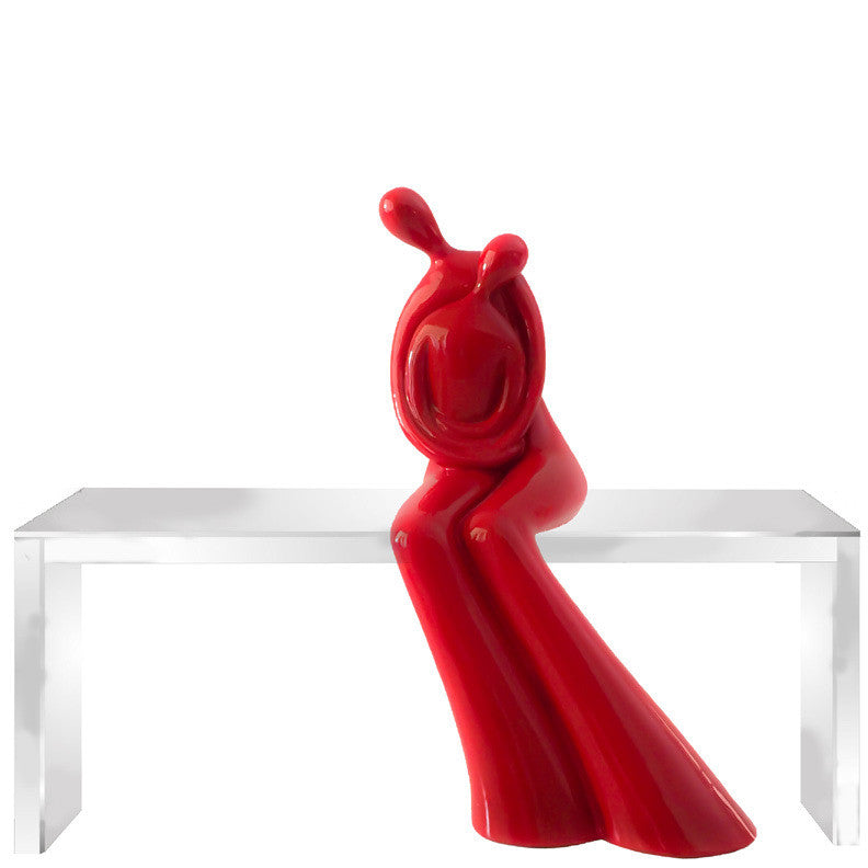 Hug sculpture on bench by Vassiliki (red)