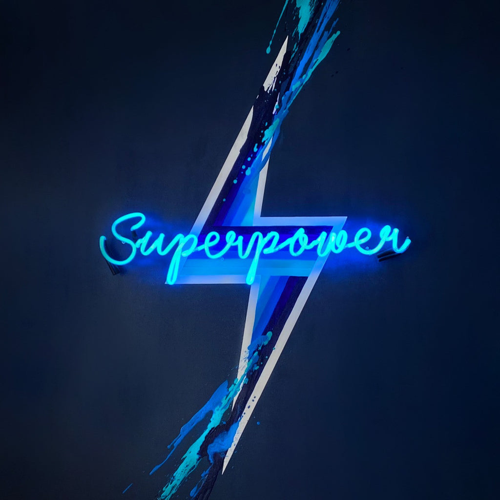 Superpower neon lights on Blue Canvas by Caroline Rovithi
